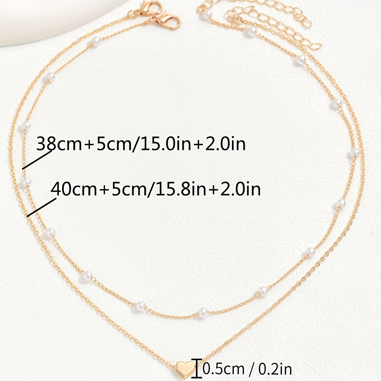Meliora | Women's delicate pearl necklace with heart pendant | Gold