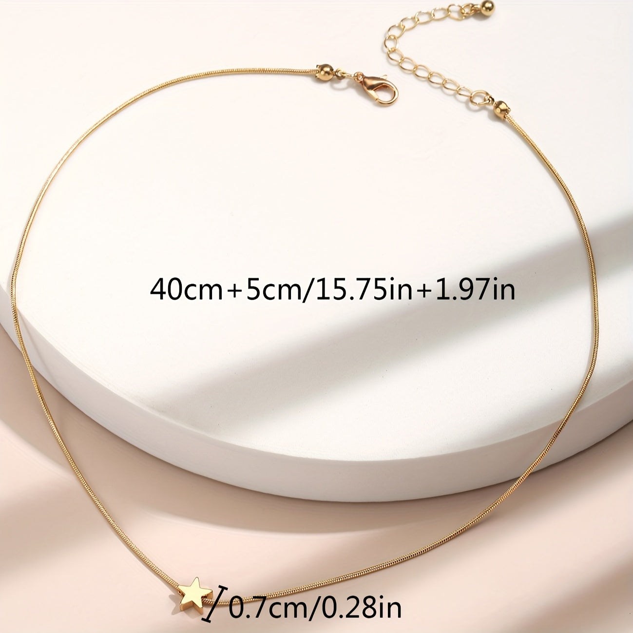 Solmira | Women's heart and star pendant necklace on snake chain | Gold