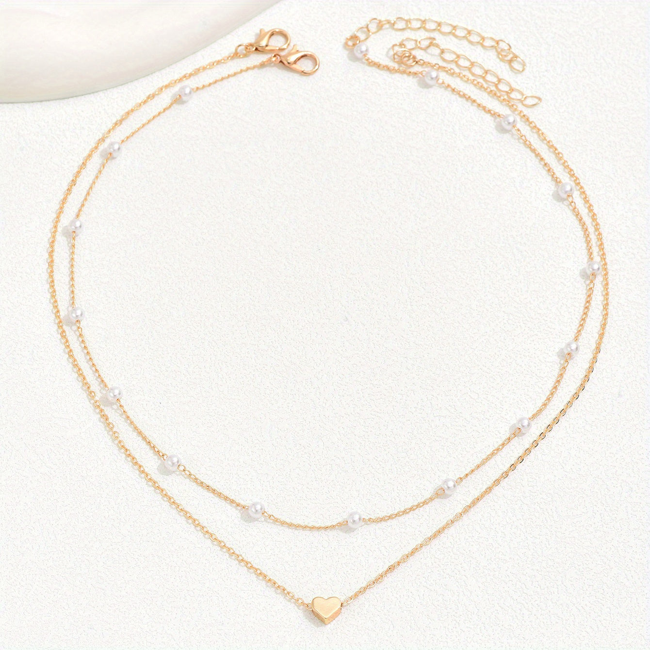 Meliora | Women's delicate pearl necklace with heart pendant | Gold