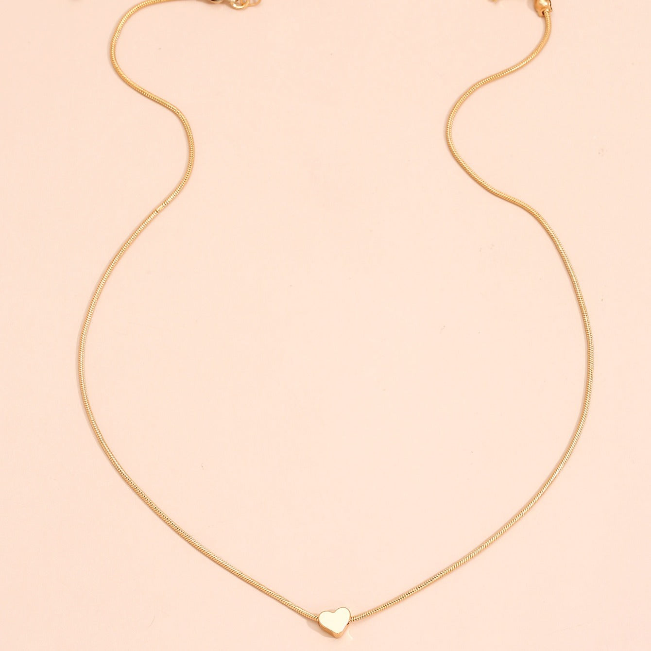 Solmira | Women's heart and star pendant necklace on snake chain | Gold