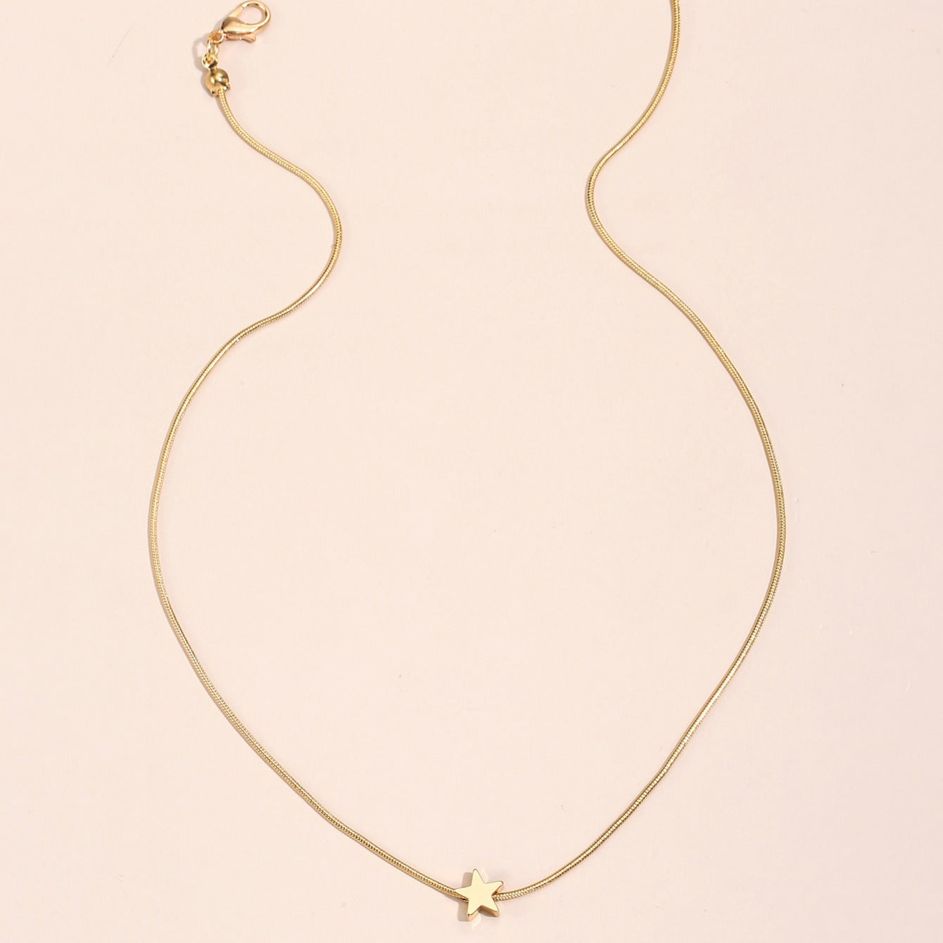 Solmira | Women's heart and star pendant necklace on snake chain | Gold