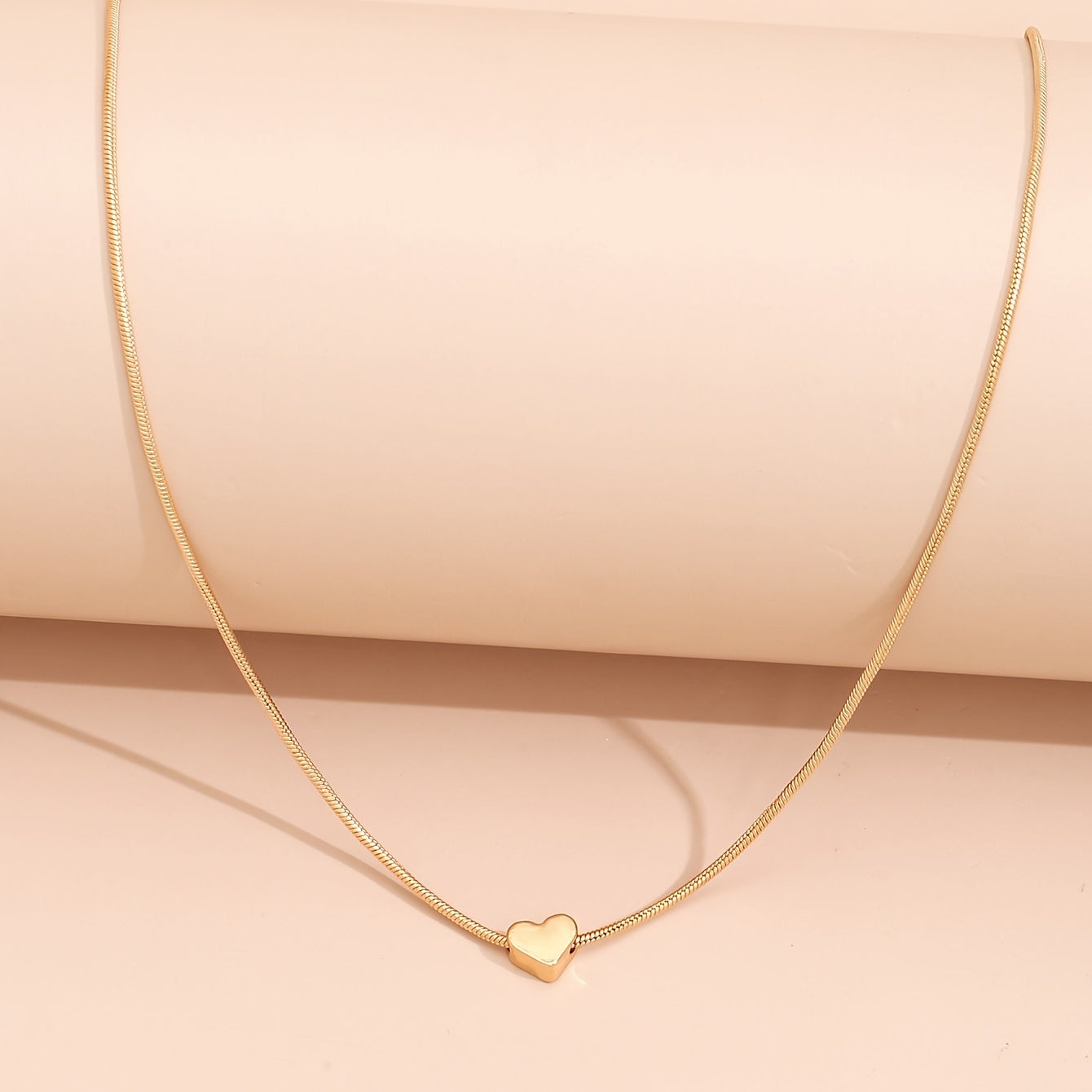 Solmira | Women's heart and star pendant necklace on snake chain | Gold