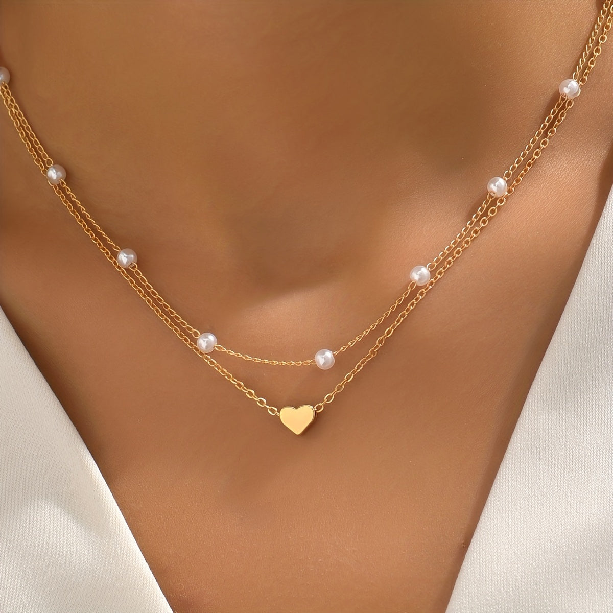 Meliora | Women's delicate pearl necklace with heart pendant | Gold