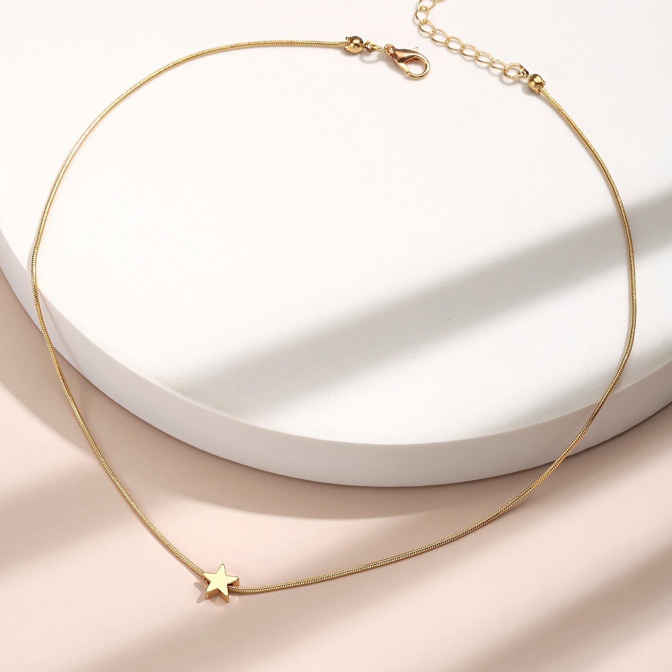 Solmira | Women's heart and star pendant necklace on snake chain | Gold