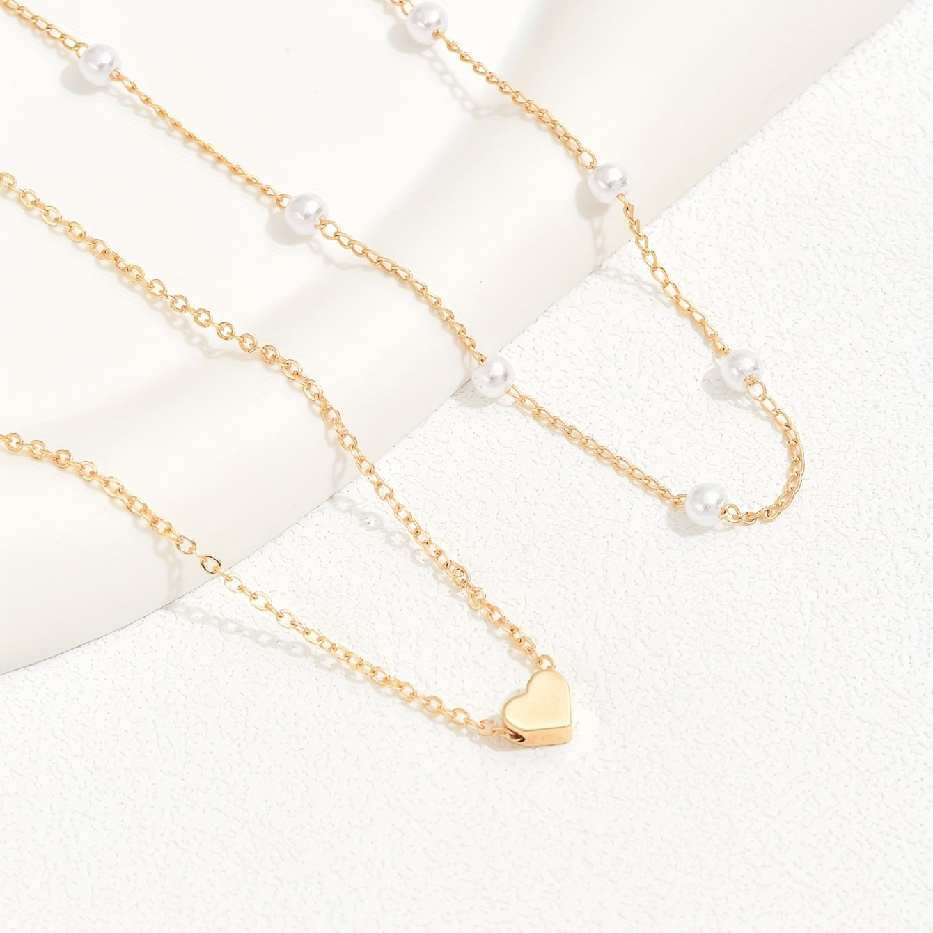 Meliora | Women's delicate pearl necklace with heart pendant | Gold